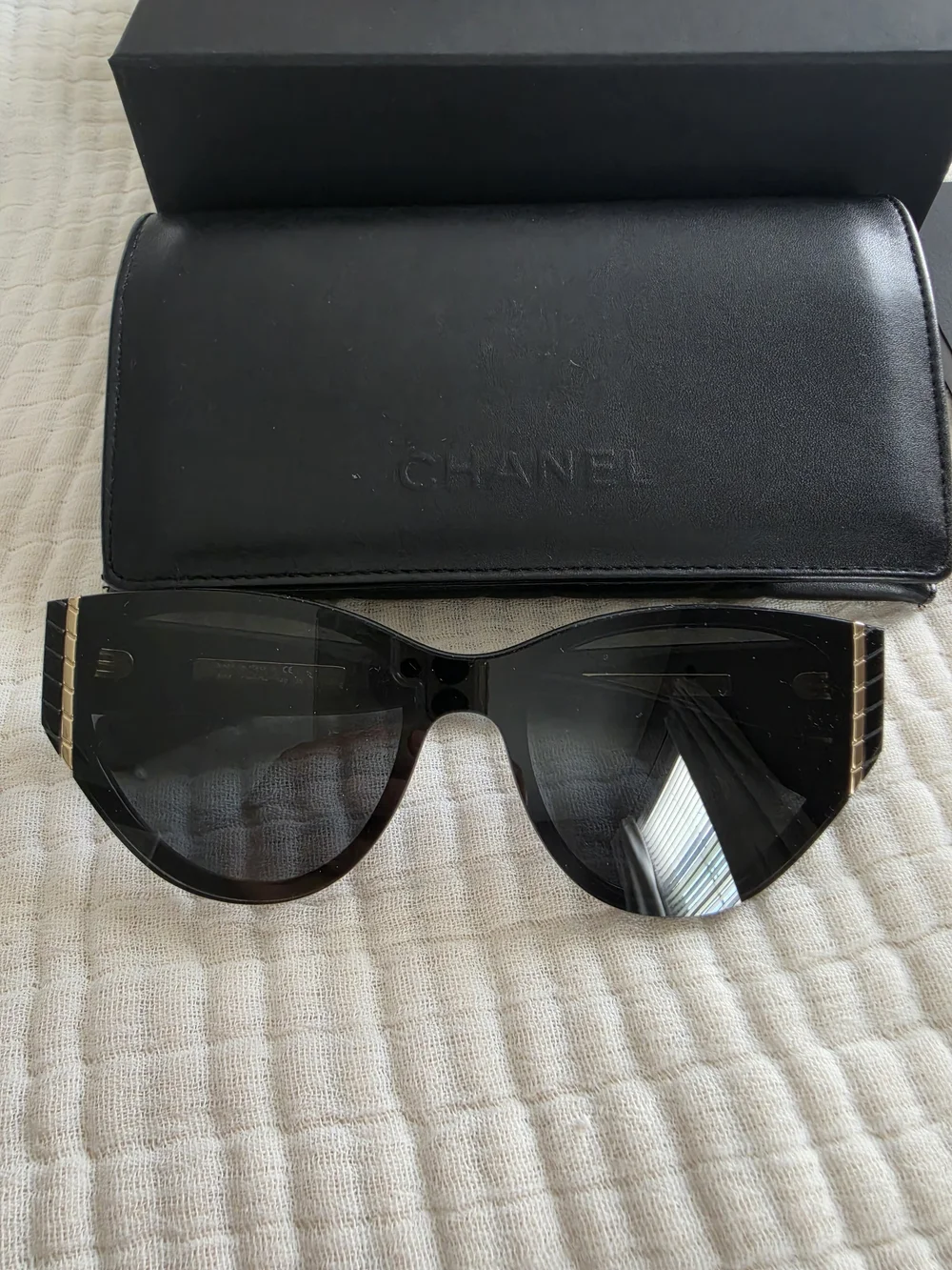 CHANEL Black Cat-Eye Sunglasses with Gold Trim